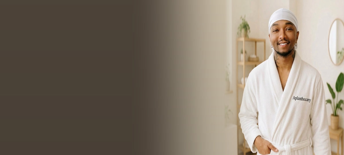 Jujhar Negrron, founder of Aplanthecary, in an Aplanthecary robe