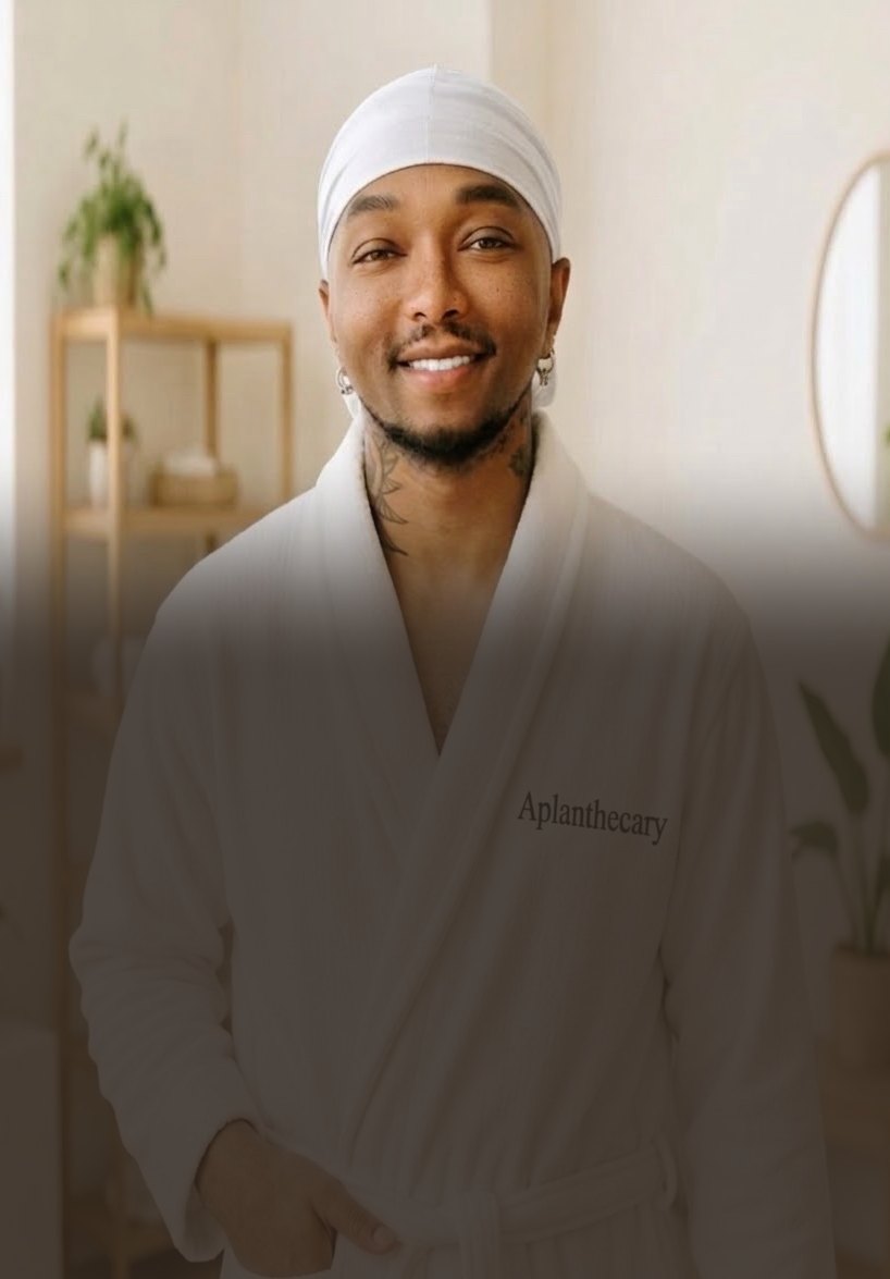 Jujhar Negrron, founder of Aplanthecary, in an Aplanthecary robe (mobile hero crop)