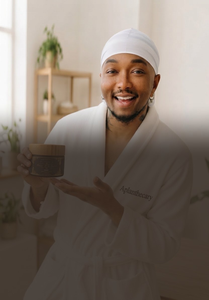 Jujhar Negrron, founder of Aplanthecary, holding a jar of Vintage Body Butter (mobile hero crop)