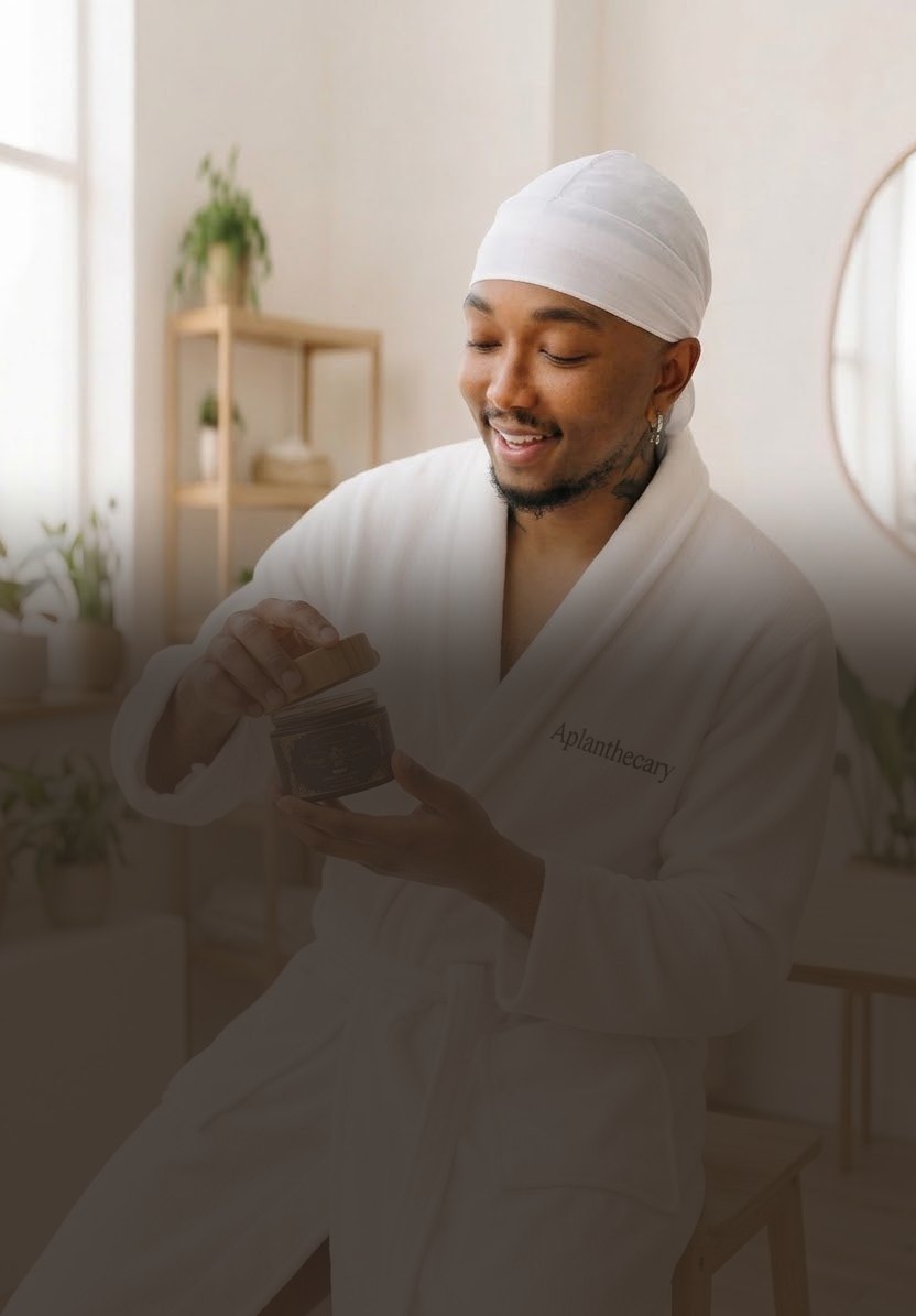 Jujhar Negrron, founder of Aplanthecary, opening a jar of Vintage Body Butter (mobile hero crop)